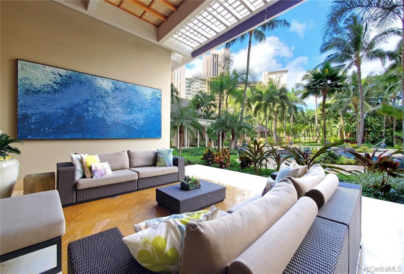 Spacious Open-air lobby looking at beautiful gardens.