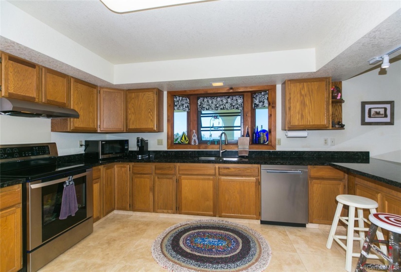 A Dream Kitchen for the person who cooks!  Top of the line Range/Oven with Stainless appliances! Bay Window looking out to your back yard and the view beyond! Shaker cabinets and granite counters!