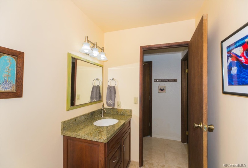 This is the 1/2 bath on the ground floor for your guests to use! Beautiful granite counters!