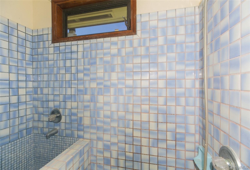 This is the full bathroom on the ground floor.  It is off the covered lanai and has a Japanese Furo Bath!  Soak in this tub and your stress for the day disappears!