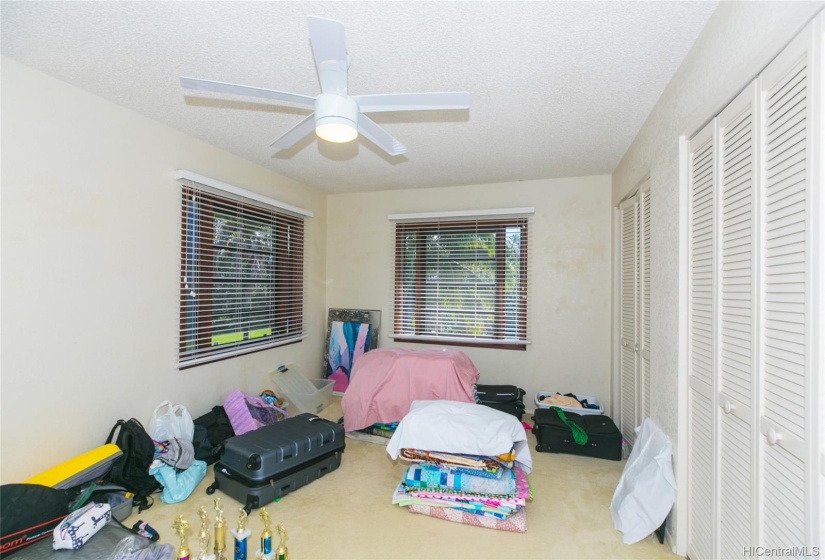 4th Bedroom upstairs and this room is exceptionally large!  Good cross ventilation and good storage in this 4th bedroom