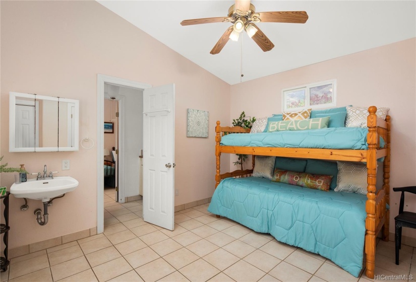 Two more bedrooms adjoined by a half bath are on the other side of the home ... large families wanting to Live, Work, Play and Vacay together will LOVE this!