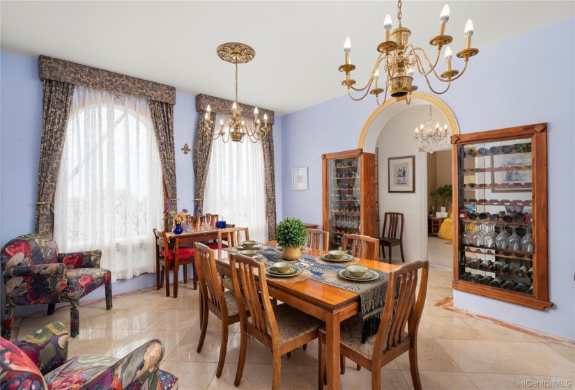 Around a formal dinning table a great dinner with some vino is always a great idea! Gifts of wine and champagne from everyone's travels to and from Hawai'i can be displayed in the gorgeous wine racks!