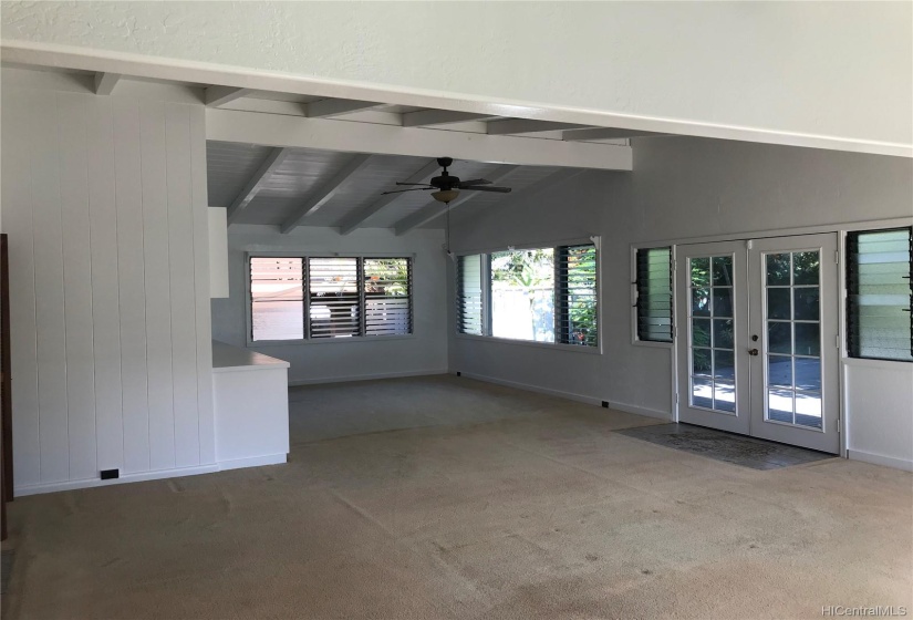 Living and dining room which opens out onto the large deck and yard to the Crozier Loop entrance.