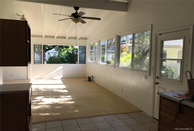 View from kitchen looking into expansive living room area.