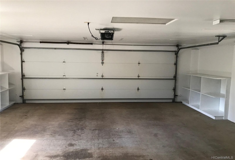 2 car garage has plenty of storage shelves!