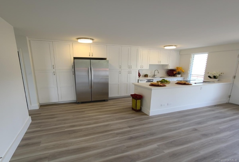 Kitchen Renovated With Floor to Ceiling Storage and Appliances Layout for Convenience.