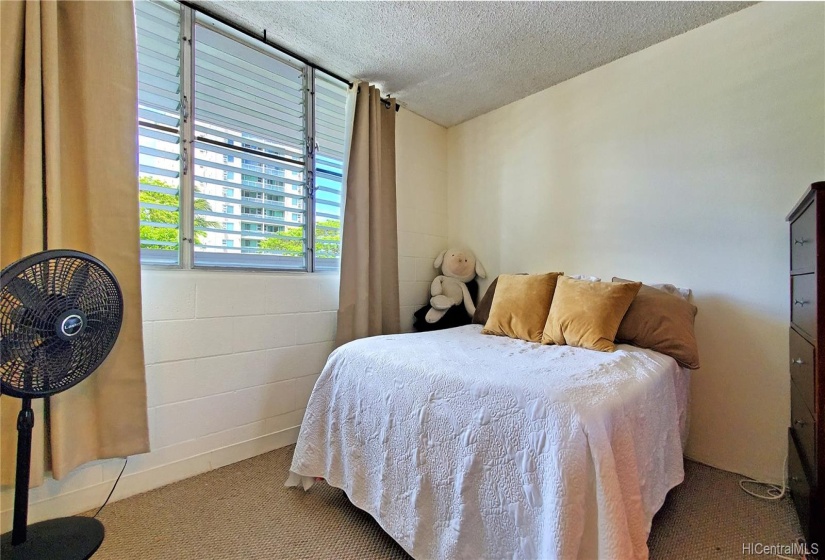 Second bedroom w/ mirrored closet doors and upgraded carpet