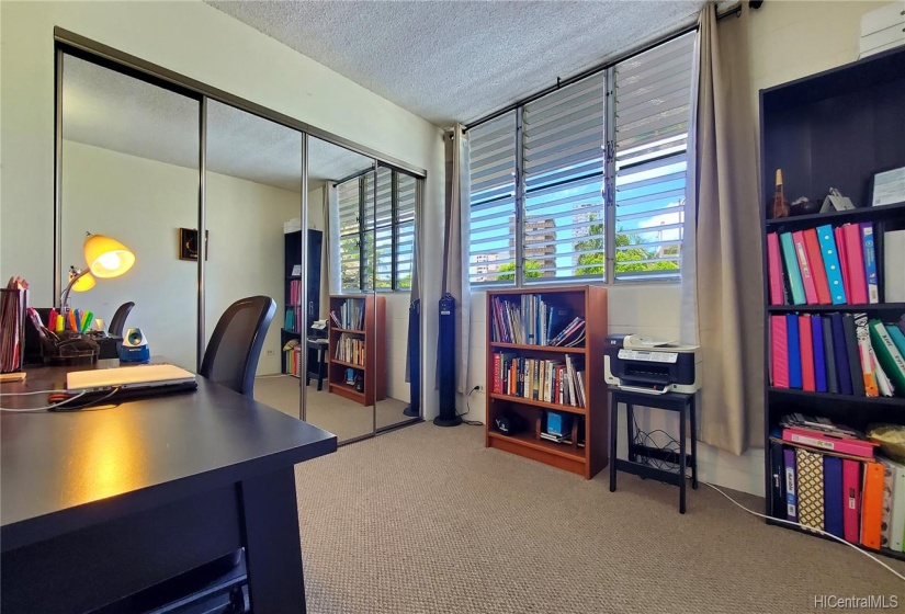 Third bedroom used as an office w/ mirrored closet doors and upgraded carpet.