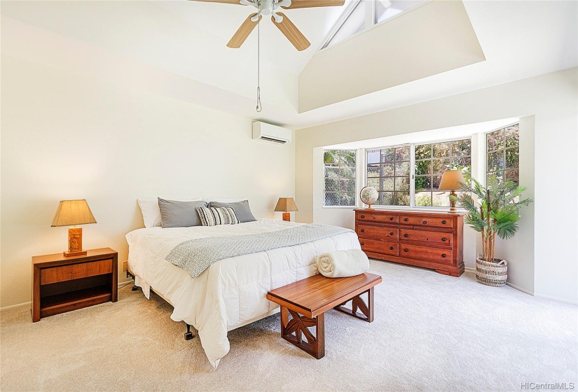 Master bedroom suite has soaring vaulted ceilings & huge bay window