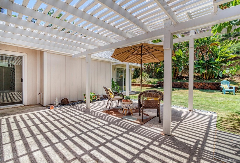 The heart of this home is the huge lanai and lovely backyard.