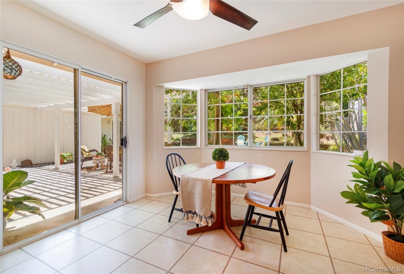 Dining area just off the kitchen is bight and airy with large trademark bay window.