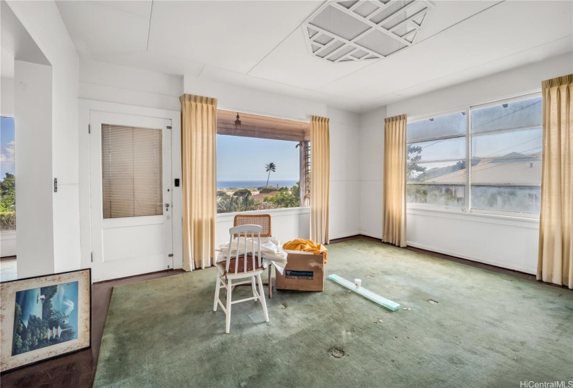 Inside the dining room/bonus area to the right of the living room.