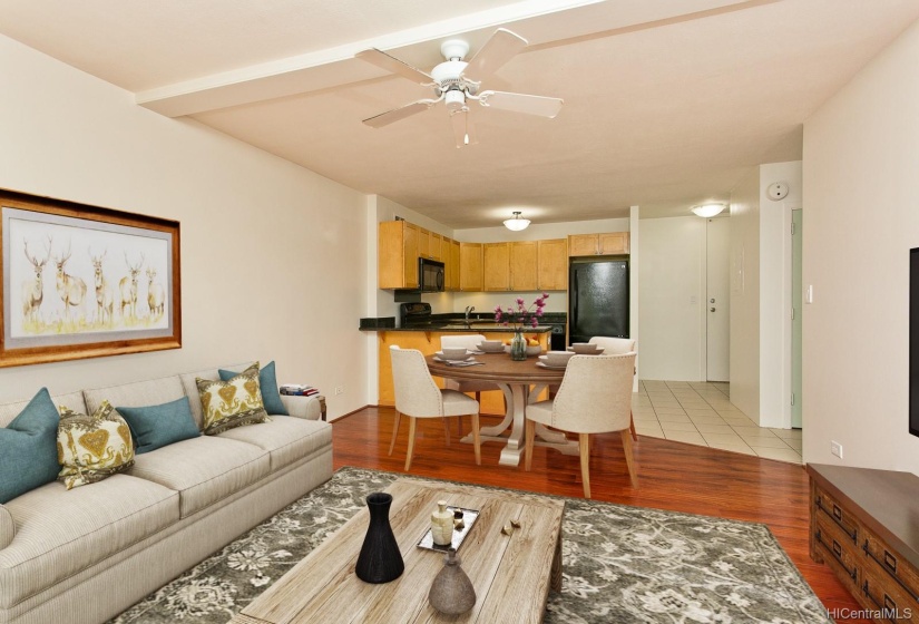 Looking towards the kitchen and entrance foyer of the unit. This photo has been virtually staged.