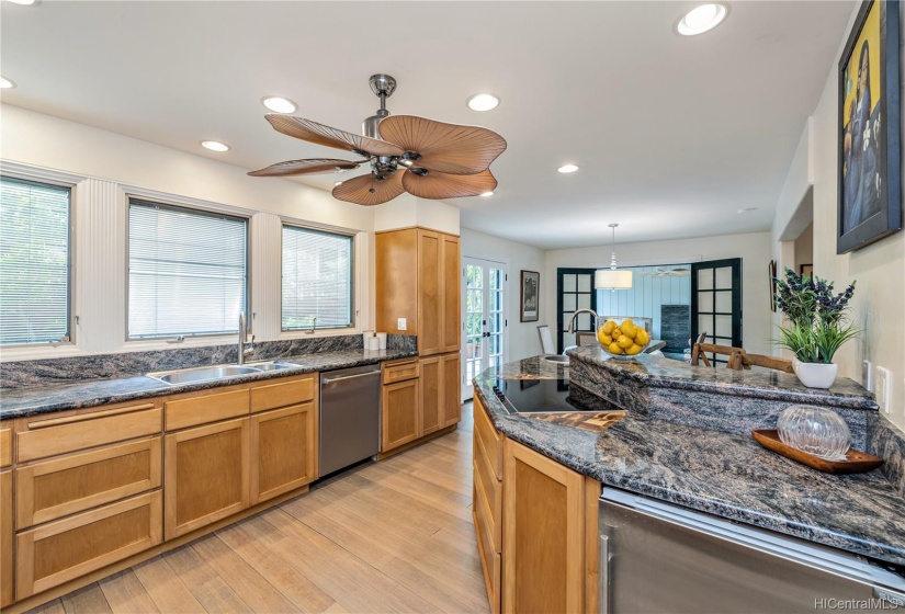 Kitchen flows into Dining area and Patios,.