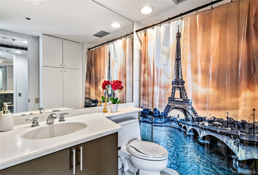 Bathroom with a bathtub and built-in shelves