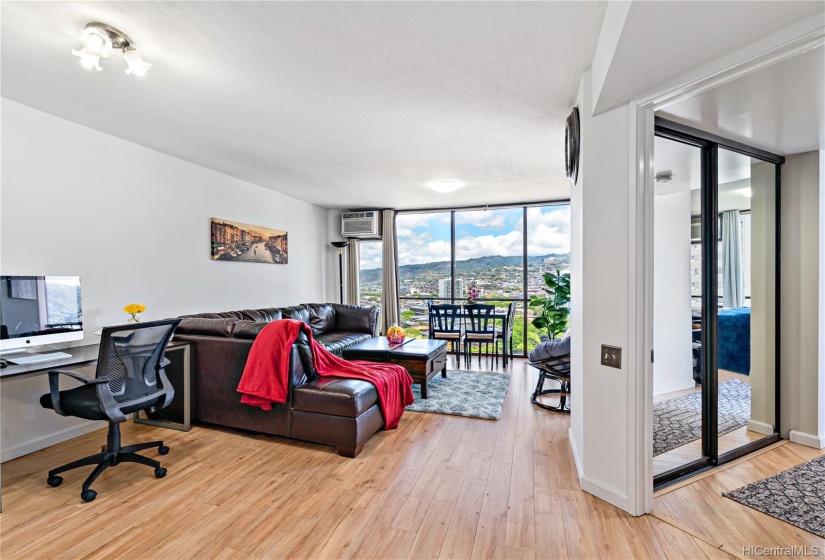 Living room is spacious enough to fit an office desk as well