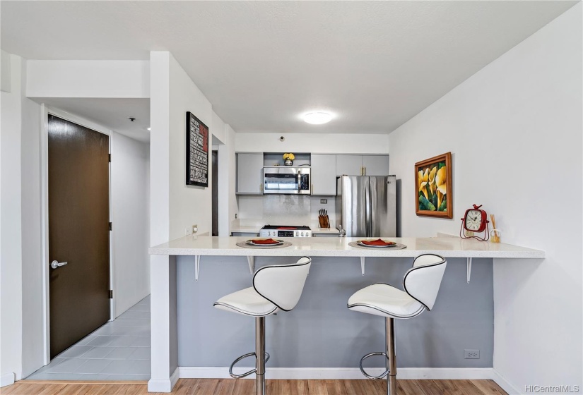 Next to the kitchen is a laundry room with a pantry