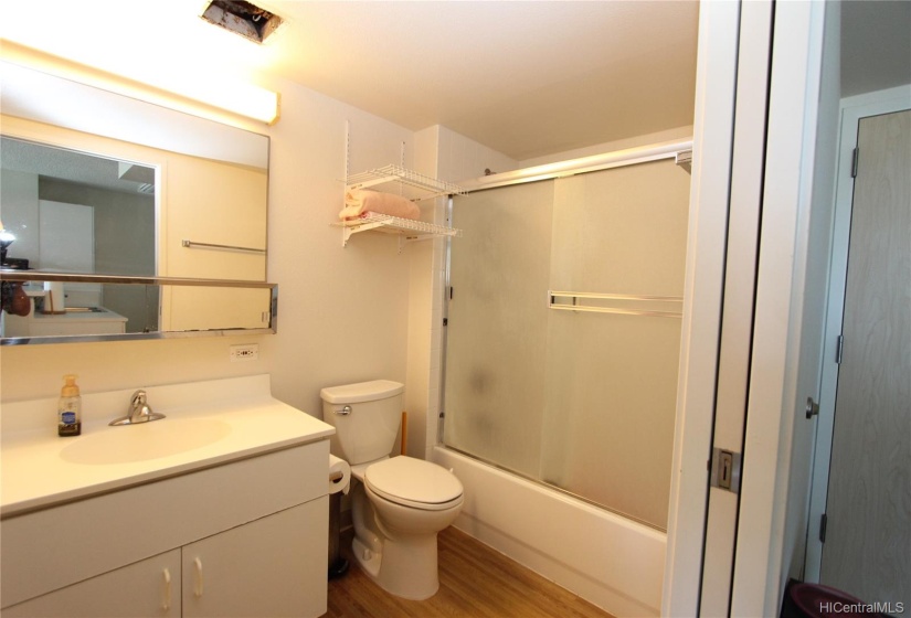 Bath located off the entry with washer dryer. Guest don't have to go through your bdrm to get to the bath