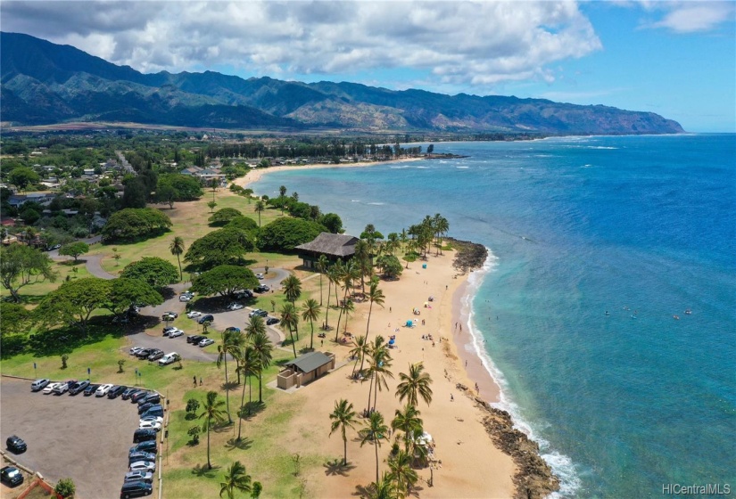 Overhead view of Hale'wa Beach Park with views of Kaena Point in the distance.