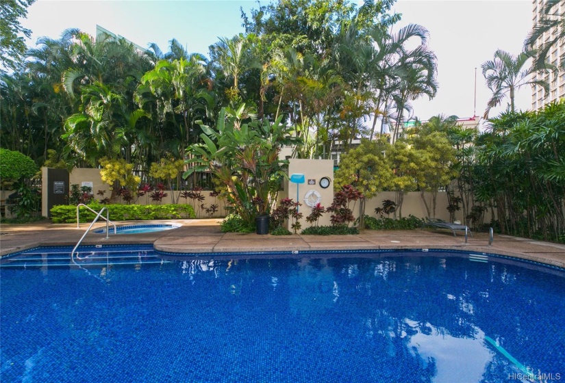 Pool area and hot tub on the lush, gated grounds of Honolulu Tower.