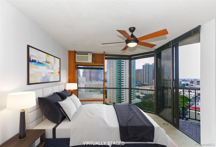 The primary bedroom is large and has lots of windows and light and an awesome view. Lanai entry on right.