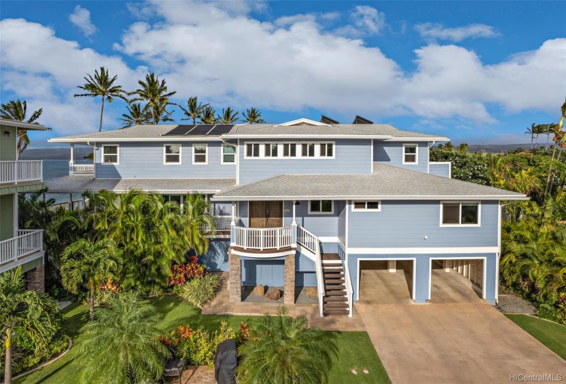 4 Car Garage with additional driveway spaces.