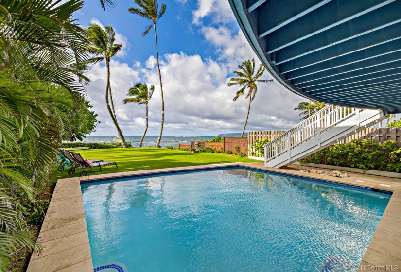 Enjoy sunsets from the oceanfront pool and huge grassy area leading down to the beach.