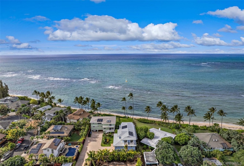 This Waialua Oceanfront home is an ideal getaway location situated on a quiet stretch of beach.