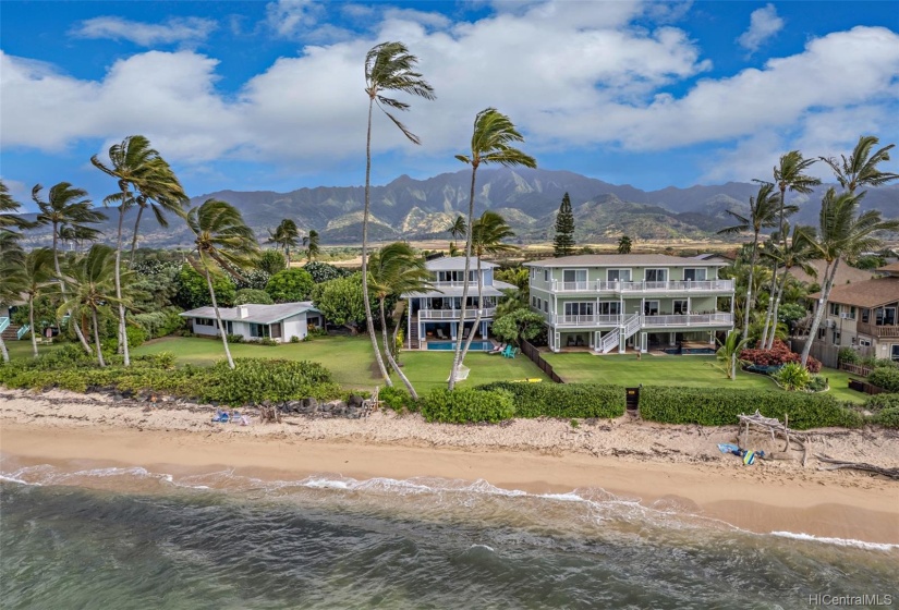 This Waialua oceanfront home is situated on a very quiet and exclusive stretch of sandy beach on the North Shore with Mt Ka'ala in the background.