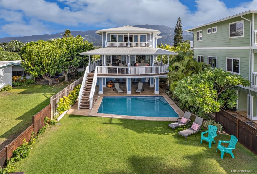 Huge grassy area off of the pool leading straight to the beach.