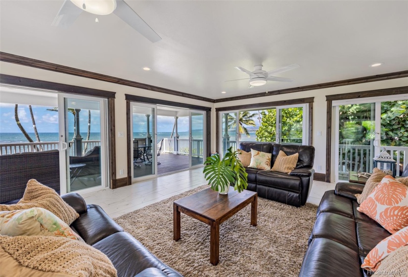 Stunning ocean views from the living area leading out to the covered lanai space.