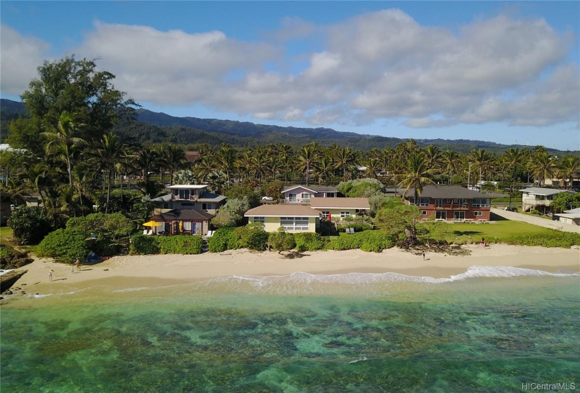 Houses and beach in front.