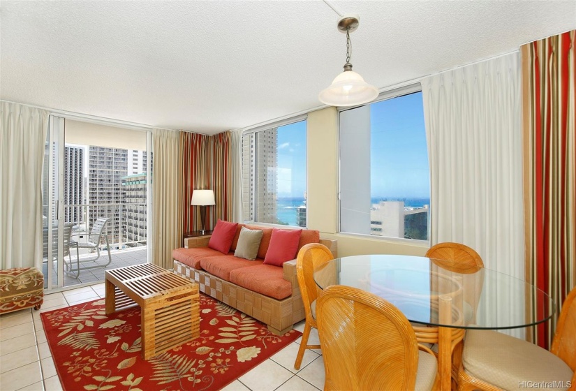 Living space extends onto lanai overlooking the stunning surroundings.