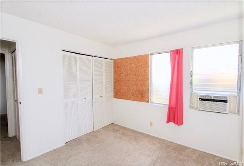 Bedroom 3 (cork board on wall beside window)