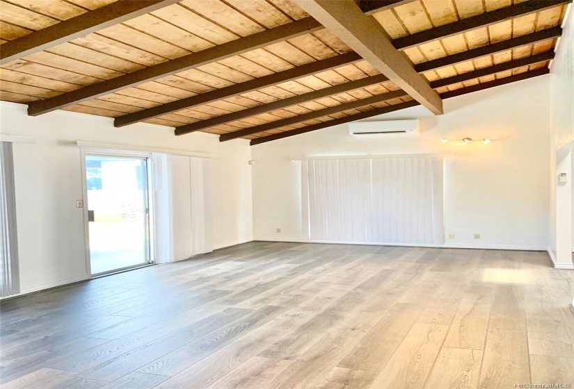 Bonus room with beamed ceilings and split AC unit