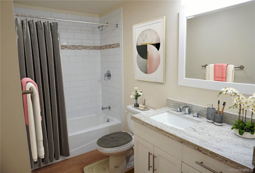 Bathroom with tub/shower & long countertop-virtually staged.