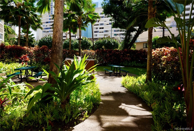 Nice landscaping leading to pool area.