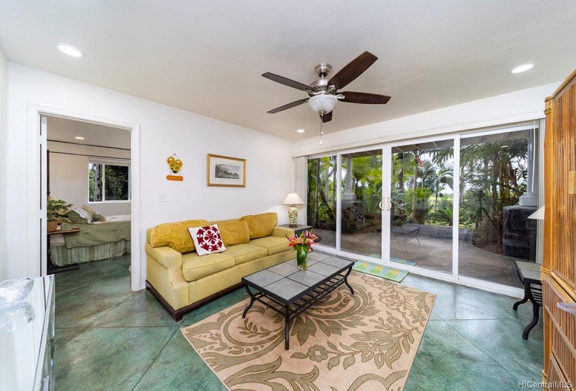 Second large living area that opens up to the concrete deck and stairs that lead into the gardens