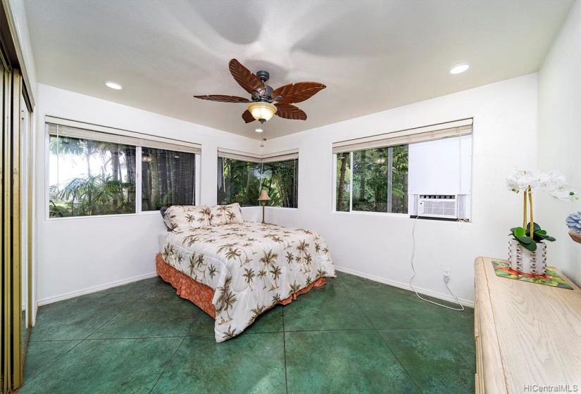 Fourth large bedroom with garden views.