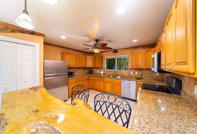 Large kitchen with lots of cabinets.