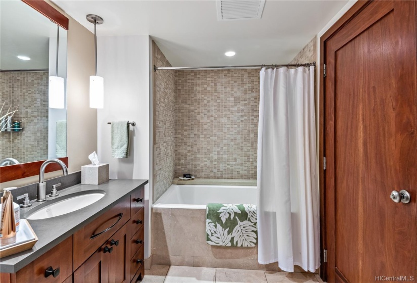 3rd bathroom with a shower/soaking tub combo