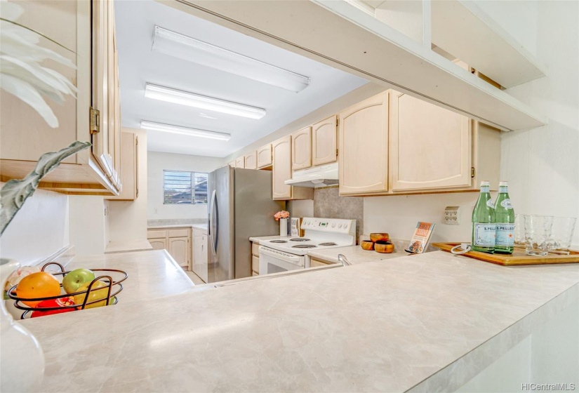 Kitchen opens into living area