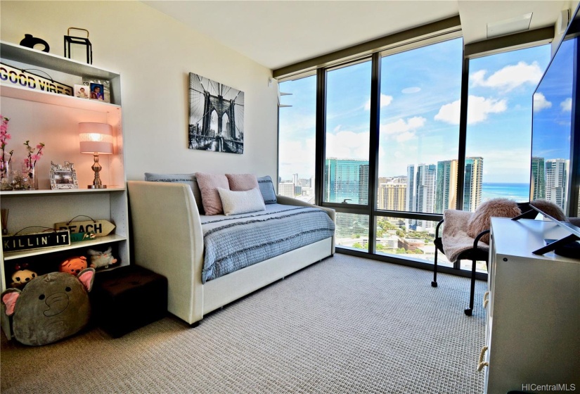 Second bedroom with gorgeous view and electric shades.