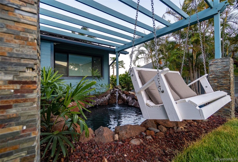 Swing set in front of Koi Fish Pond