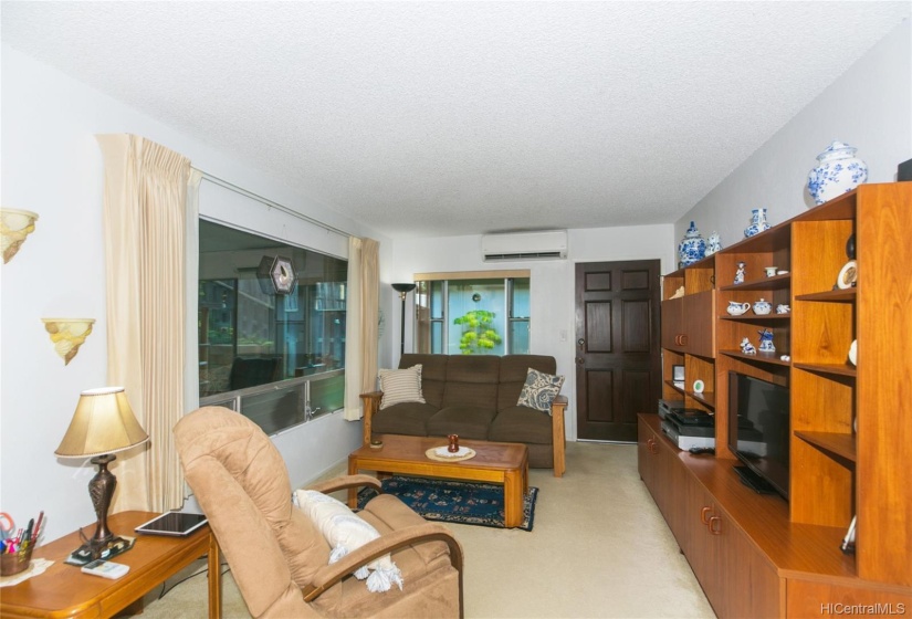 Living room with attached sunroom.