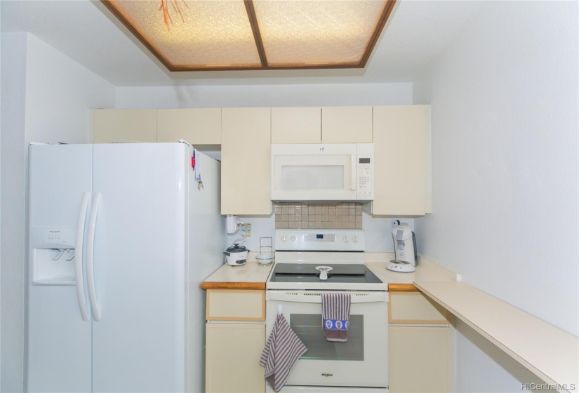 Kitchen with white appliances.