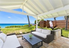 Spacious lanai leads to a wide sandy beach