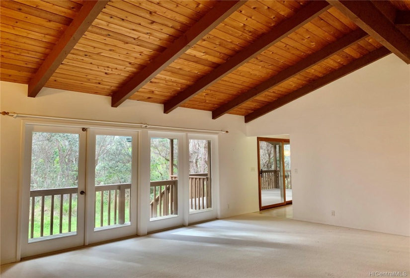 A bright, spacious home at a high elevation with a cool climate, surrounded by forest but still part of a community.