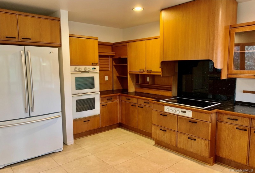 A cooks kitchen with plenty of storage and space to cook.